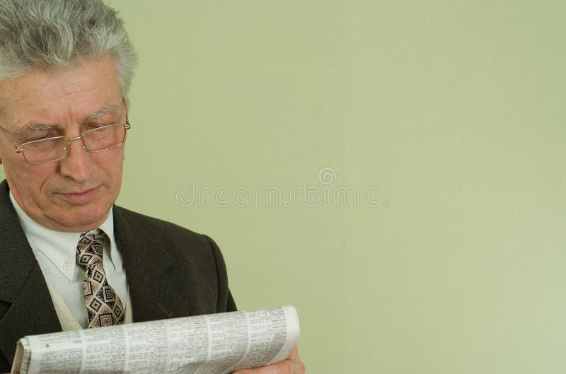 Handsome businessman read the newspaper
