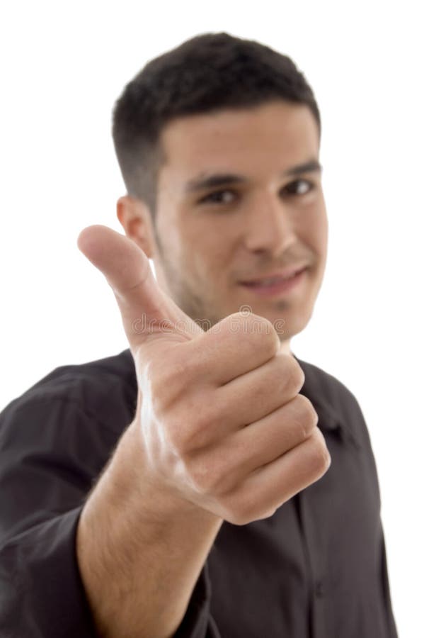 Handsome businessman showing thumbs up