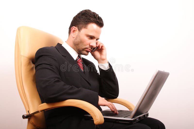 Handsome calling businessman with laptop 3