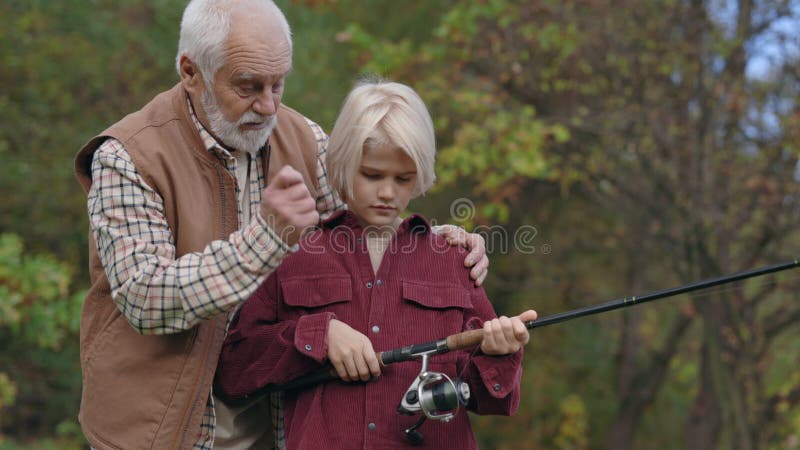 Happy Boy Watching How His Grandfather Casting Fishing Rod Stock Footage -  Video of people, family: 246827868