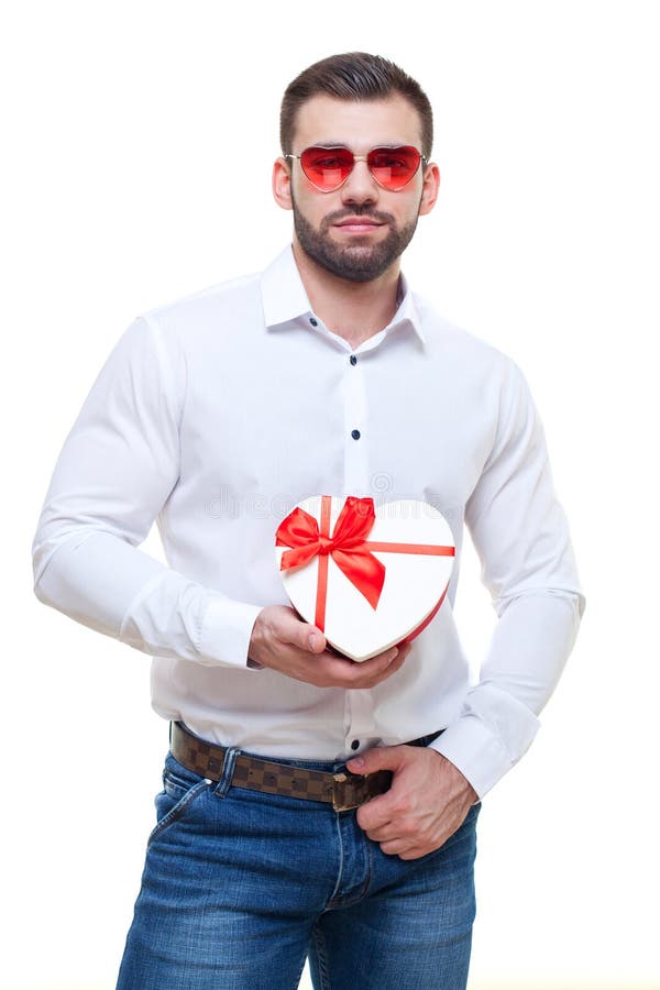 Handsome Elegant Guy Is Presenting A Heart Shaped T And Balloons To His Beautiful Girlfriend