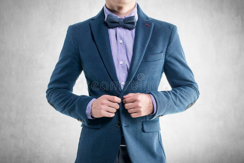 Handsome elegant young fashion man in coat tuxedo