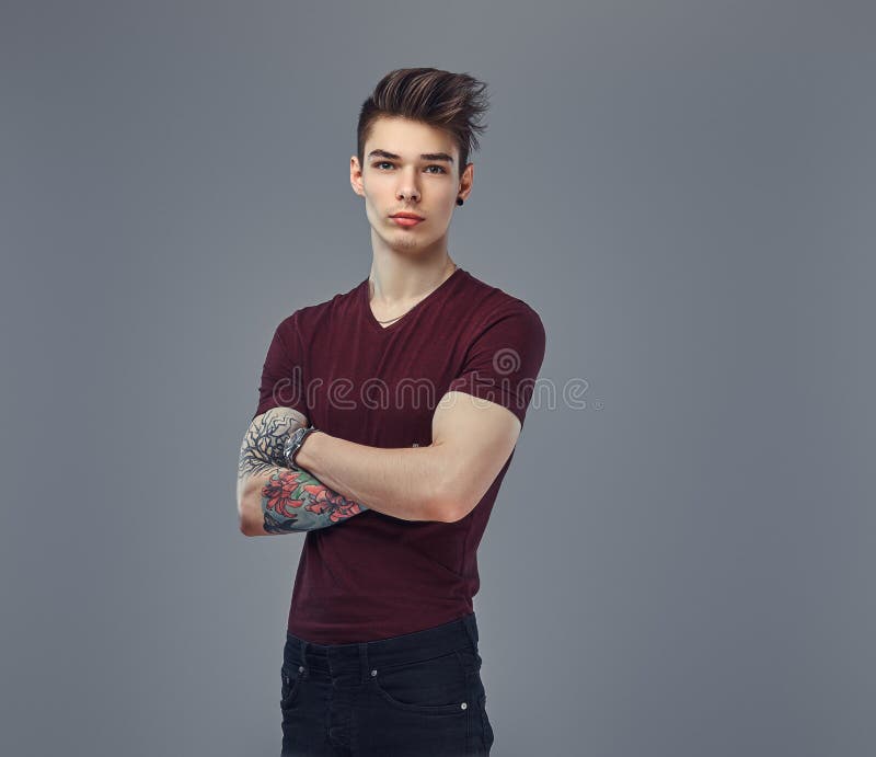 Handsome Fashionable Young Guy with Stylish Hair and Tattoo on His Arm  Posing in a Studio. Stock Photo - Image of hair, attractive: 116549230