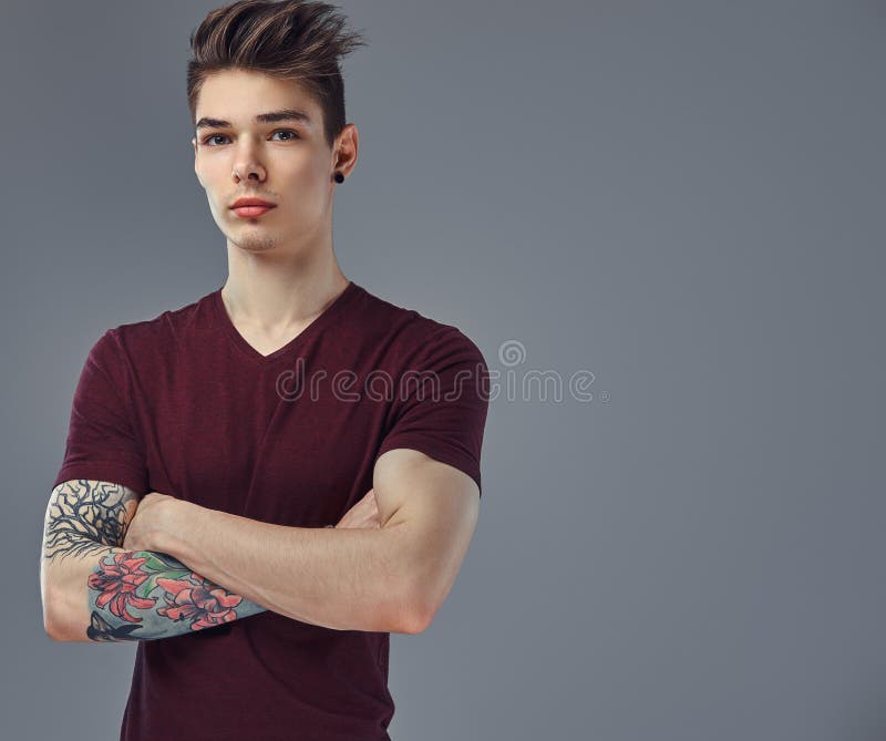 Handsome Fashionable Young Guy with Stylish Hair and Tattoo on His Arm Posing in a Studio. Stock Photo - Image of confidence, caucasian: 116549528 Handsome Fashionable Young Guy with Stylish Hair and Tattoo on His Arm Posing in a Studio. Stock Photo - Image of confidence, caucasian: 116549528