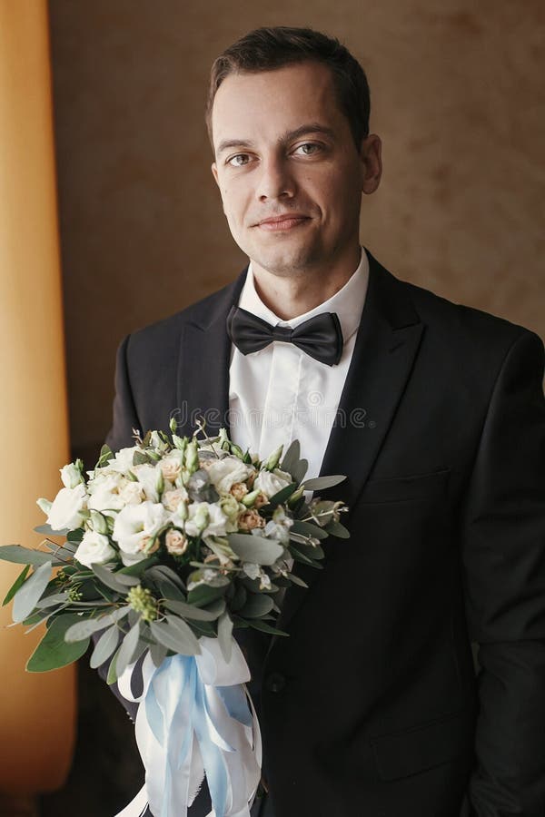 Handsome Groom Portrait with Stylish Wedding Bouquet for Bride in the ...