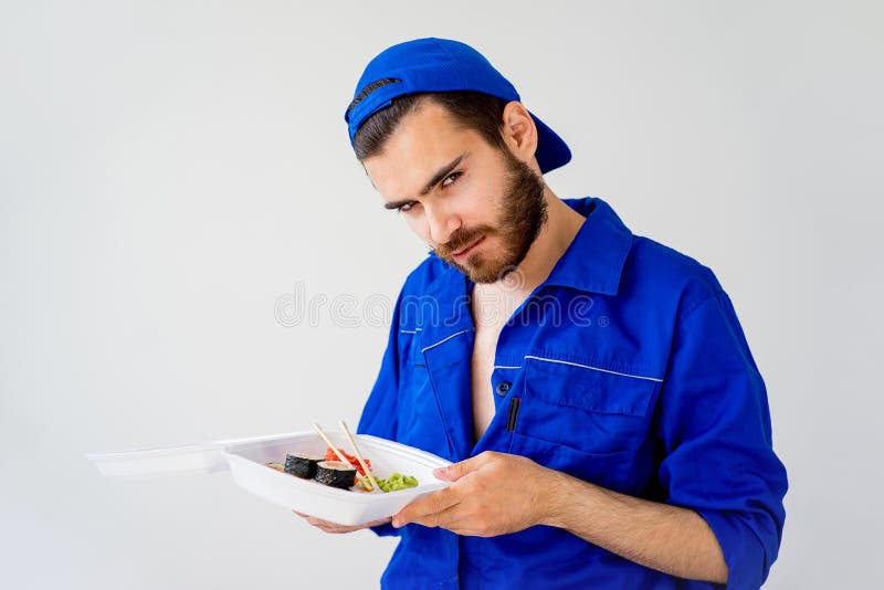 Handsome guy delivering sushi stock photo