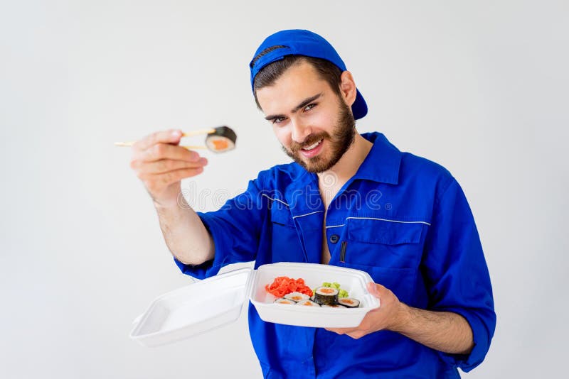 Handsome guy delivering sushi royalty free stock images