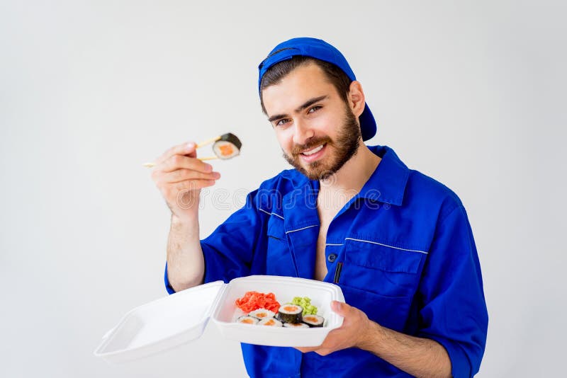 Handsome guy delivering sushi royalty free stock images