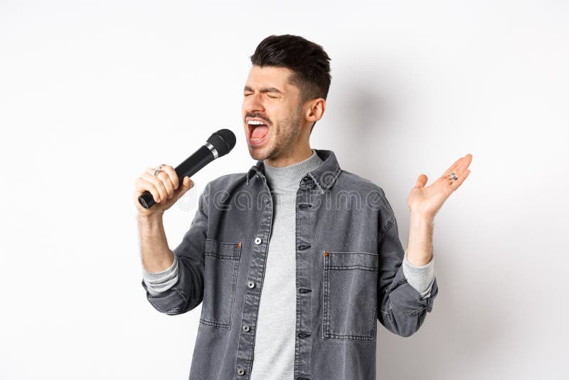 Handsome Guy Singing in Mic with Passion, Perform for Audience, Holding