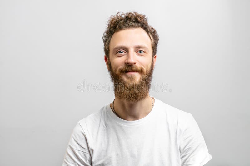 Handsome Hipster Man With Beard Smiling At Camera Over White Background