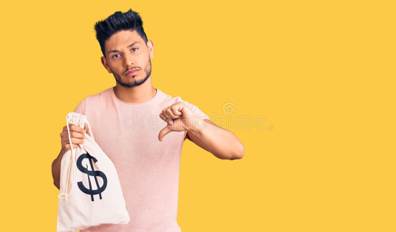 Handsome Latin American Young Man Holding Money Bag with Dollar Symbol ...