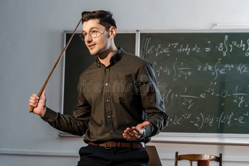 Handsome Male Teacher in Formal Wear Holding Wooden Pointer and