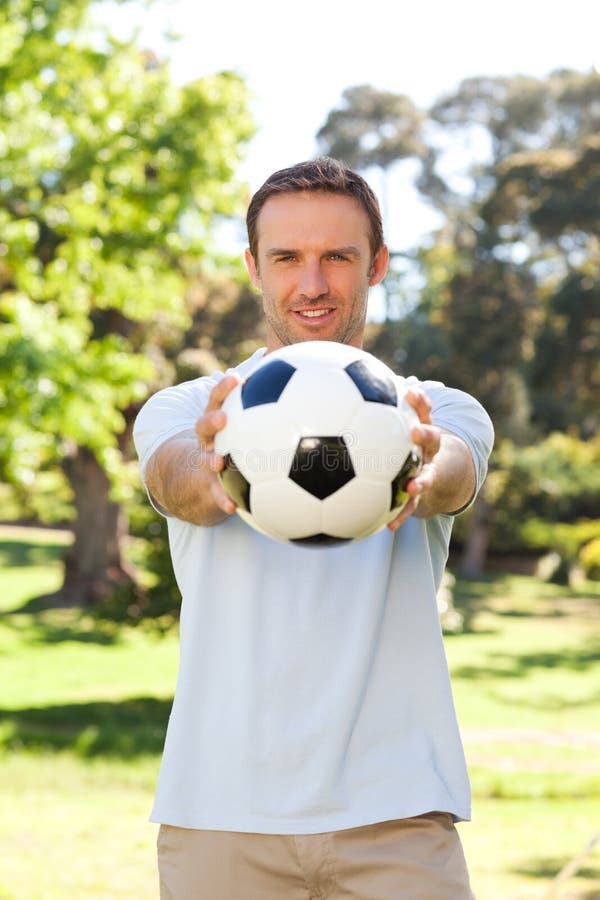 Handsome man with a ball stock photography
