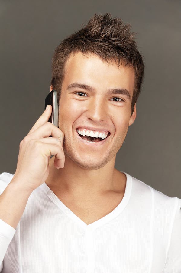 Handsome man calls by telephone royalty free stock images