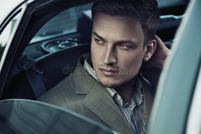 Handsome man in car