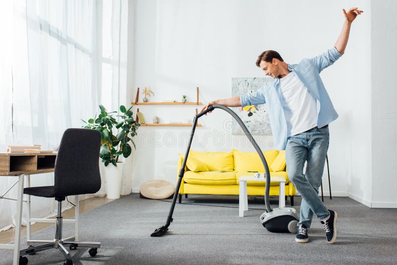 Man cleaning carpet stock photo. Image of home, dust - 105740800