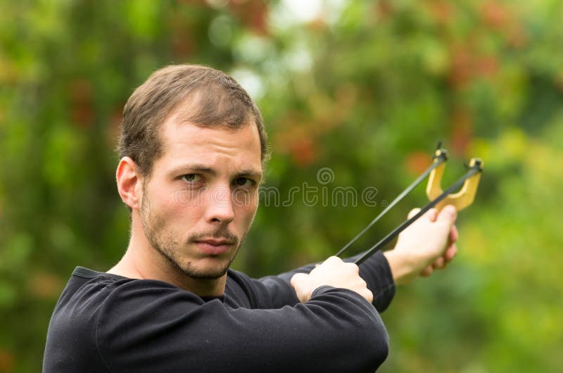 Concentrated Boy with Slingshot Aim Stock Photo Image of isolated, conceptual 24227298