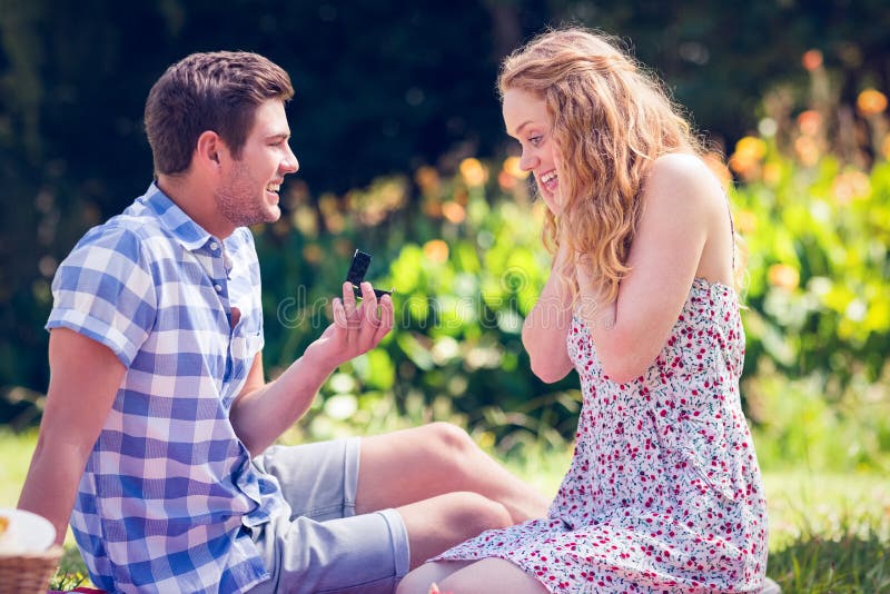 Handsome man doing marriage proposal to his girlfriend