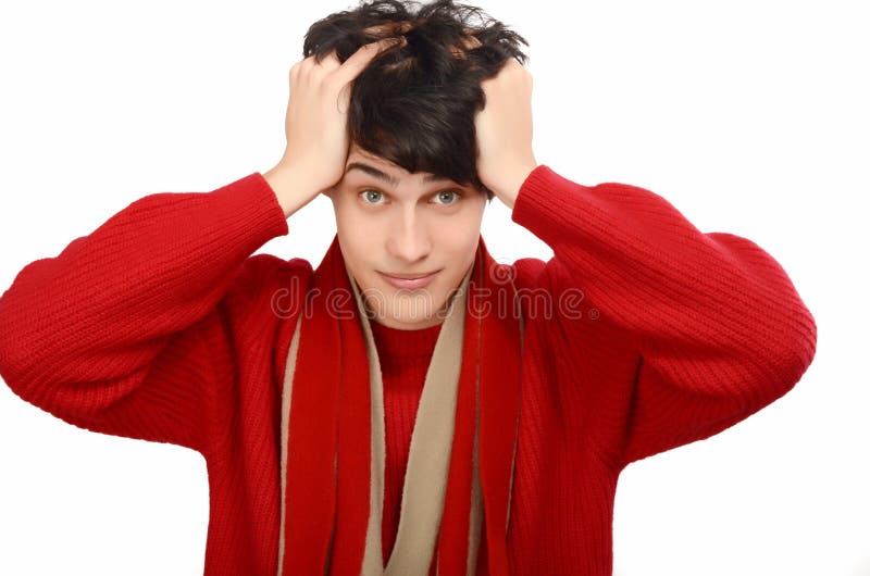 Handsome man dressed for a cold winter, worried, pulling his hear. stock photo Handsome man dressed for a cold winter, worried, pulling his hear. stock photo