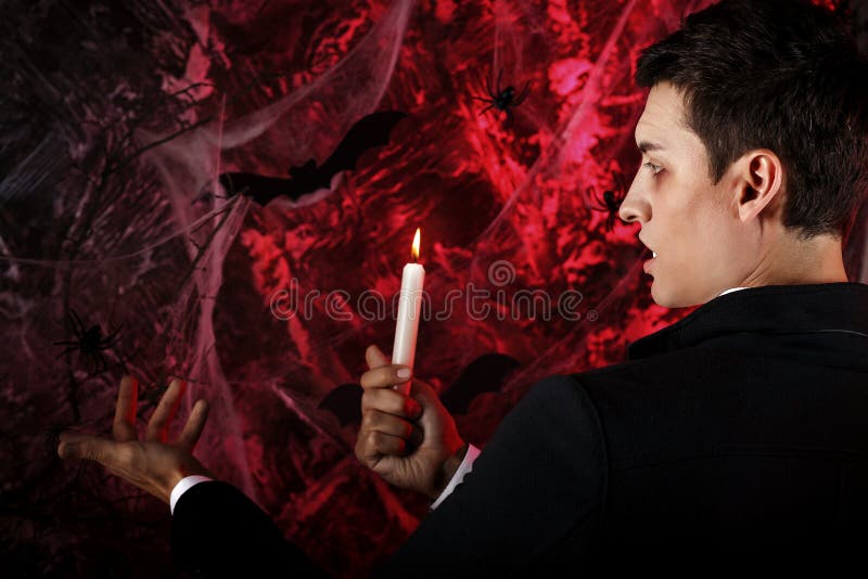 handsome man dressed in a Dracula costume for Halloween. royalty free stock photo handsome man dressed in a Dracula costume for Halloween. royalty free stock photo