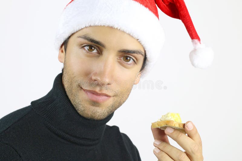 Handsome man eating a foie gras toast stock photography