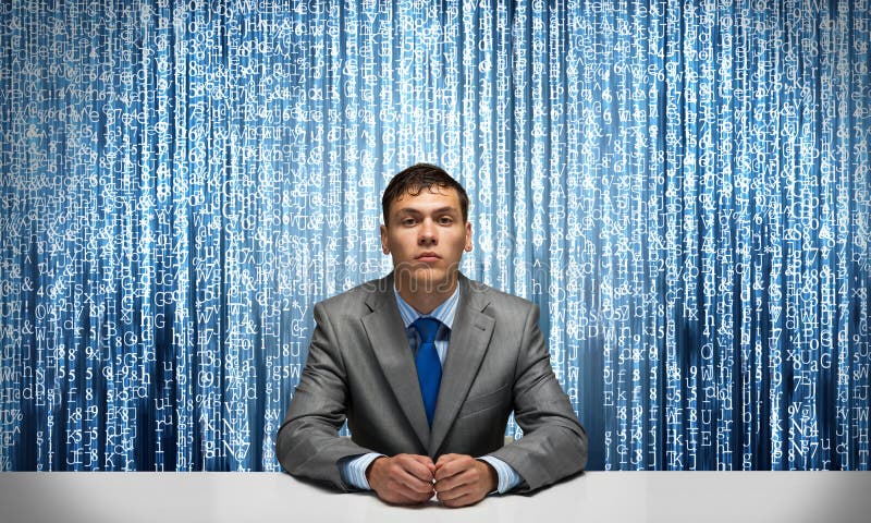 Handsome man folded hands and having serious face stock image Handsome man folded hands and having serious face stock image