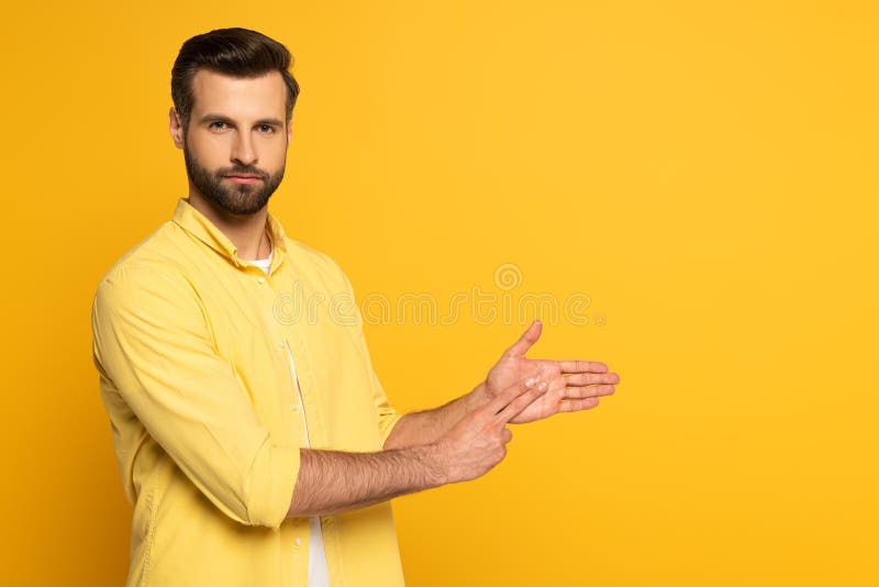 Handsome Man Gesturing While Using Sign Language Stock