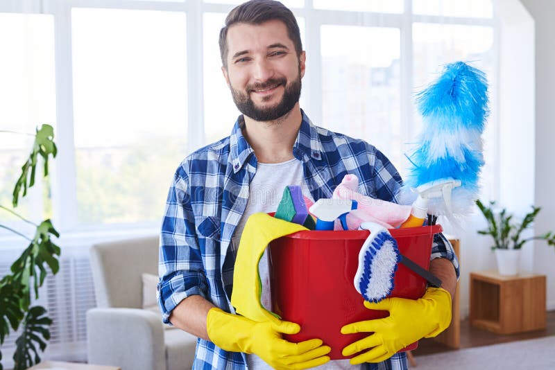 Handsome man holding nice set for cleaning