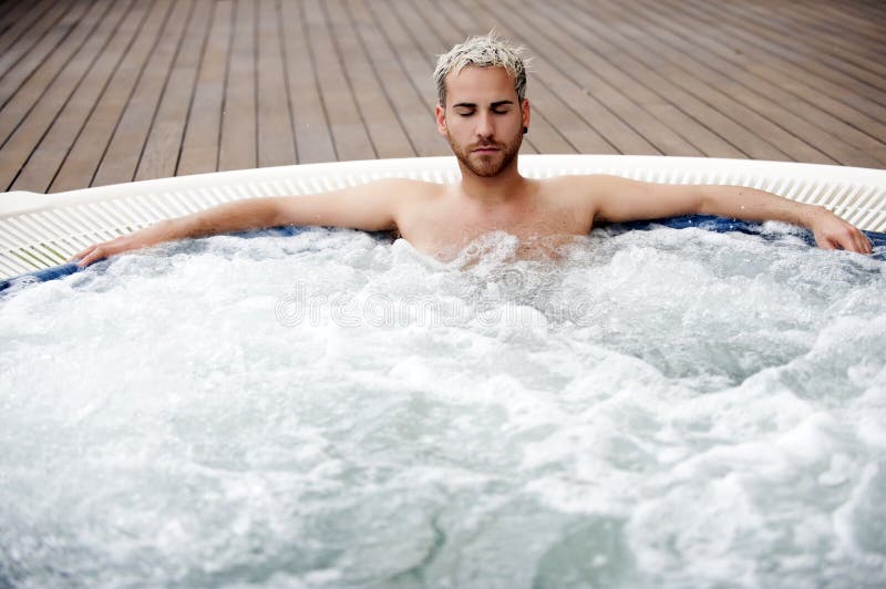 Handsome man in jacuzzi