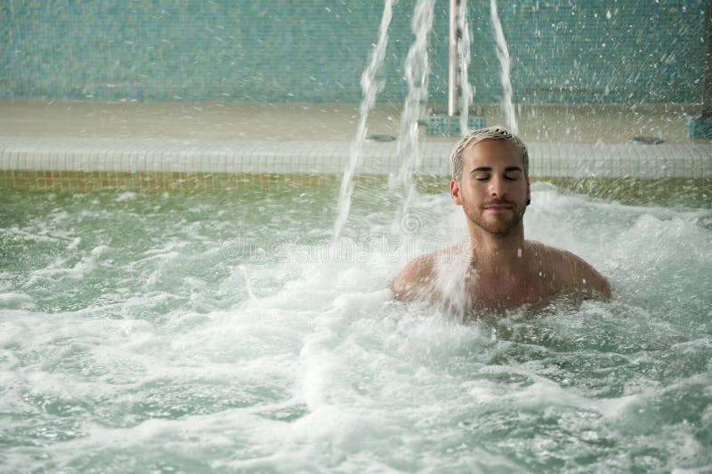 Handsome man in jacuzzi