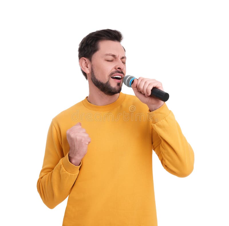 Handsome man with microphone singing on white background stock photography