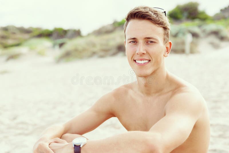 Handsome Man Posing at Beach Stock Photo - Image of lifestyle, people ...