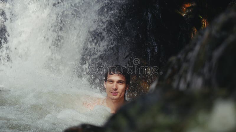 Handsome Man Relaxing Under Stream Water in Waterfall in Tropical ...