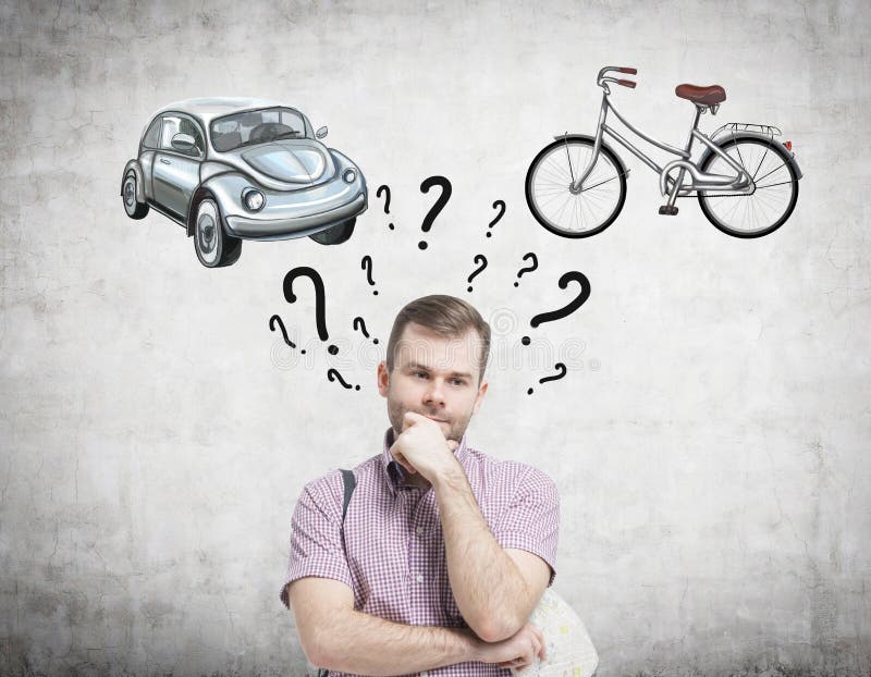 A handsome man is trying to chose the most suitable way for travelling or commuting. Two sketches of a car and a bicycle are drawn royalty free stock image A handsome man is trying to chose the most suitable way for travelling or commuting. Two sketches of a car and a bicycle are drawn royalty free stock image