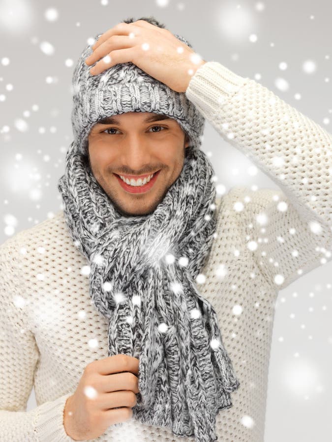 Handsome man in warm sweater, hat and scarf