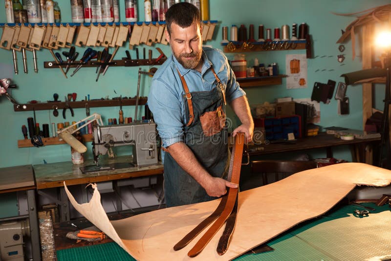 Leather Craftsman Working with Natural Leather Using Hammer. Handbag