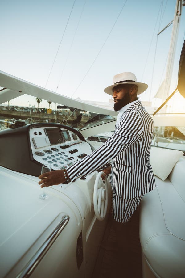 A Black Man on His Luxury His Yacht Stock Photo - Image of panel, sail ...