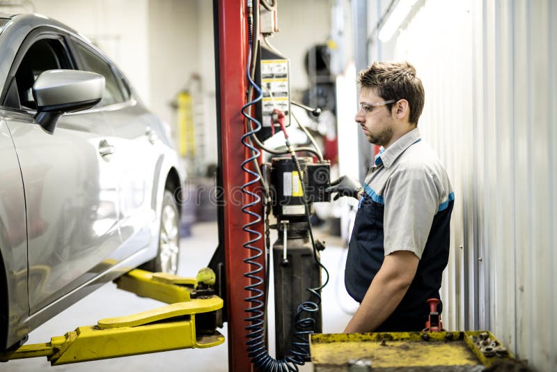 Handsome Mechanic Job in Uniform Working on Car Stock Photo Image of