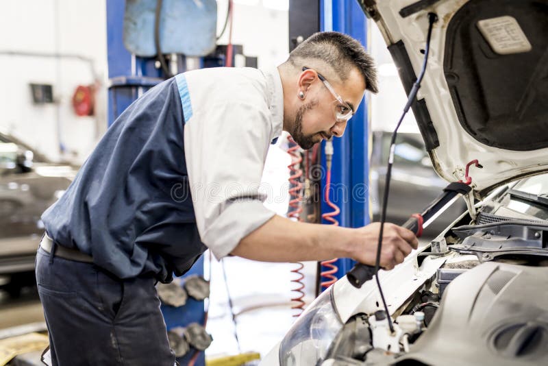 Handsome Mechanic Job in Uniform Working on Car Stock Image Image of
