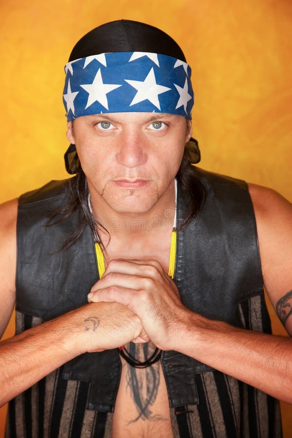 Handsome mixed race man with feather tattoo stock images