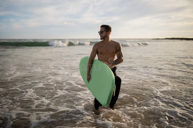 Handsome Muscular Guy Surfing Alone on Ocean Shore Stock Image - Image ...