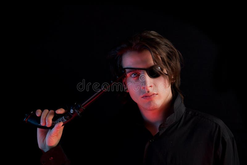 Handsome pirate with eye-patch and gun stock photo