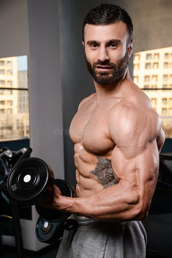 Handsome Power Athletic Man on Diet Training Pumping Up Muscles Stock