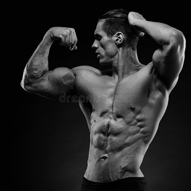 Perfectly Sculpted Strength. A Muscular Man Looking Down. Stock Photo,  Picture and Royalty Free Image. Image 194676756.