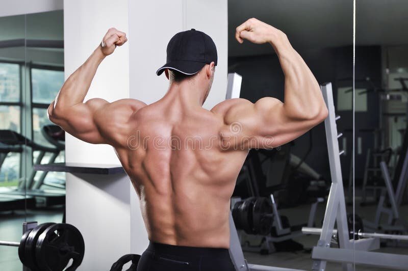 Handsome Powerful Athletic Man Posing at the Gym. Stock Image - Image ...