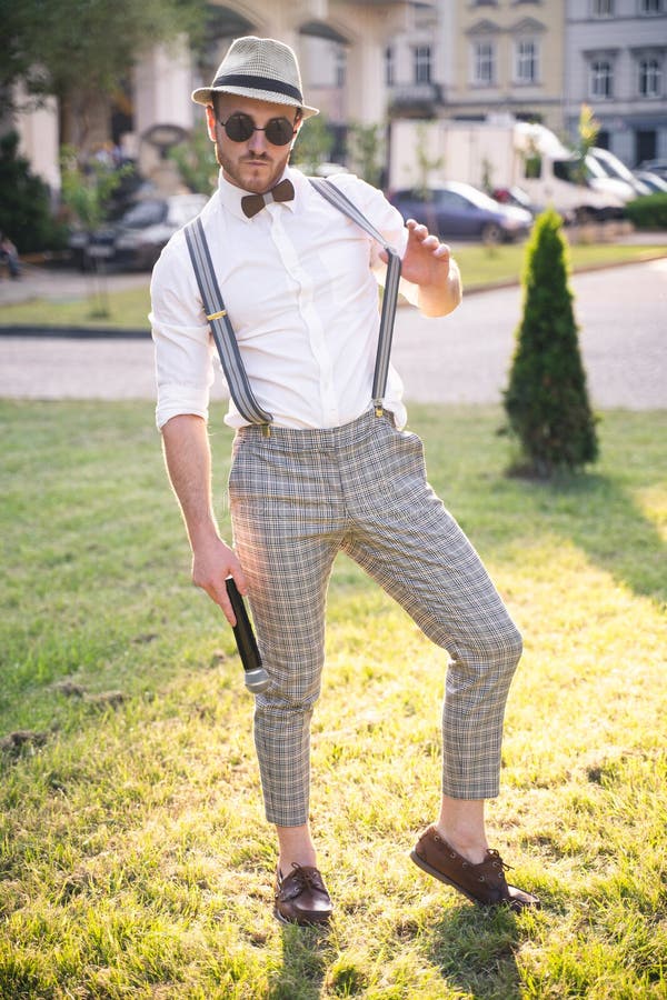 Handsome Presenter and Showman in a Stylish Suit and Hat with a ...