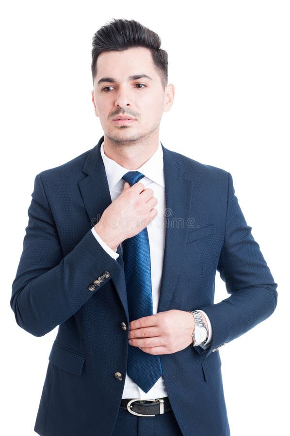 Businessman Fixing and Adjusting White Shirt Sleeve Under Blue S Stock