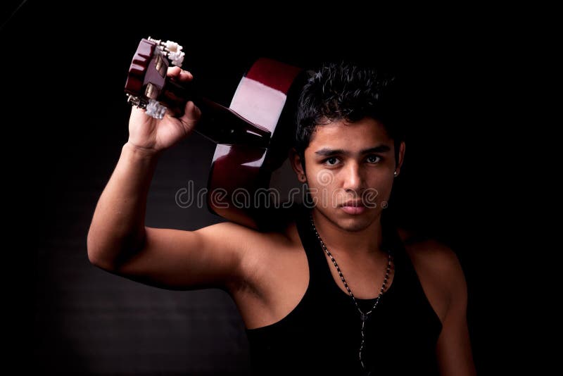 Handsome young latin man musician guitar play