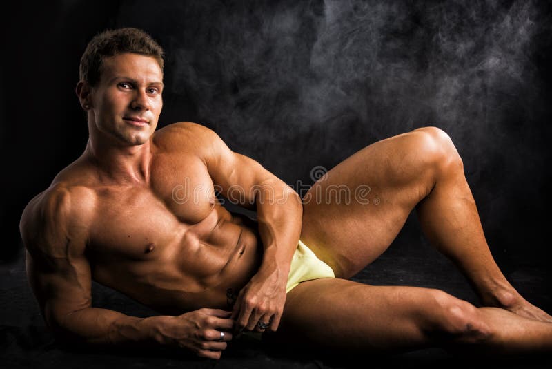 https://thumbs.dreamstime.com/b/handsome-shirtless-muscular-man-laying-down-floor-bathing-suit-attractive-dark-background-46304642.jpg