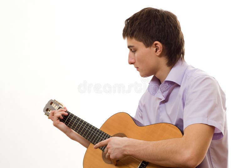 Handsome student with a guitar on a white